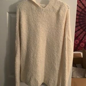 Long sleeve cream sweater; has hood